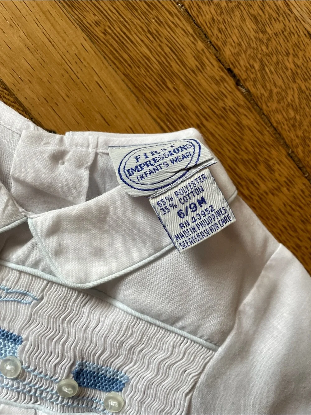 White Baby Bubble Romper with Blue Smocked Train Detail